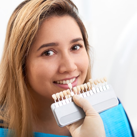 Young woman visiting doctor for veneers