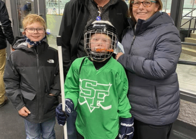 Dr. Dane with a family at a Sioux Falls Youth Hockey event
