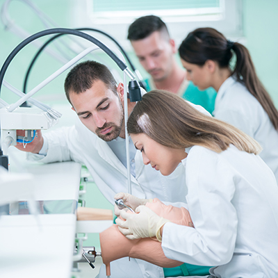 Future dentists, mentors and health technicans in training, concept
